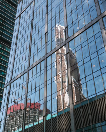View of glass wall of tower with reflection of skyscrapers in business center of Moscow City. Moscow. Russiaの写真素材