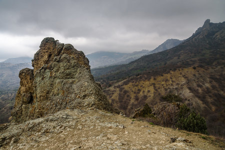 Landscape of Karadag Reserve in spring. View of rocks of ridge Karagach on cloudy day. Crimeaの写真素材