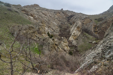 Landscape of Karadag Reserve in spring. View of rocks of ridge Karagach on cloudy day. Crimeaの写真素材