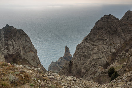Landscape of Karadag Reserve in spring. View of Rock Ivan Razbojnik of ridge Karagach on cloudy day. Crimeaの写真素材