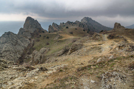 Landscape of Karadag Reserve in spring. View of rocks of ridge Karagach on cloudy day. Crimeaの写真素材
