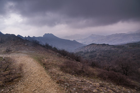 Landscape of Karadag Reserve in early spring. View of mountains in fog and clouds. Crimeaの写真素材
