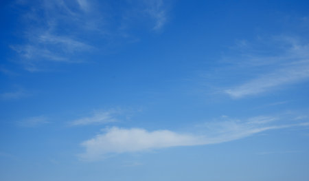 Blue sky background with white clouds, textureの写真素材