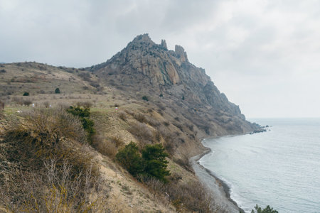 View of the crest of the coastal ridge Karagach on cloudy day in spring. Karadag Reserve. Crimeaの写真素材