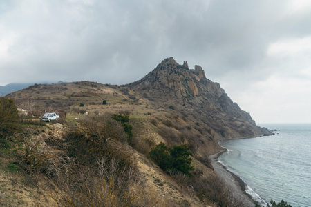 View of the crest of the coastal ridge Karagach on cloudy day in spring. Karadag Reserve. Crimeaの写真素材