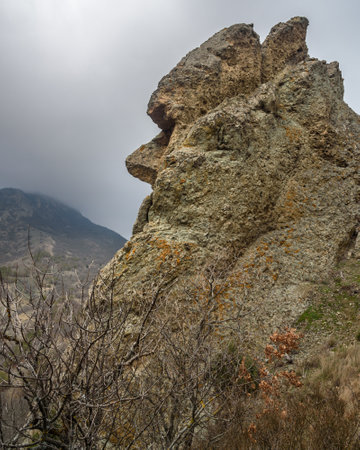 Unusual rock shape similar to human face profile. Landscape of Karadag Reserve in spring cloudy day. Crimeaの写真素材