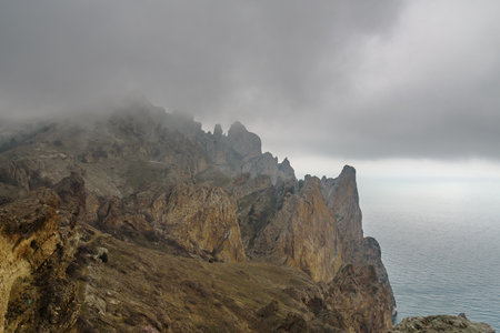Dead city in fog and clouds. Khoba-Tele Ridge of Karadag Reserve in early spring. Crimeaの写真素材