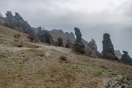 Gingerbread horse rock and bizarre rocks in Dead city. Khoba-Tele Ridge of Karadag Reserve in early spring. Crimeaの写真素材