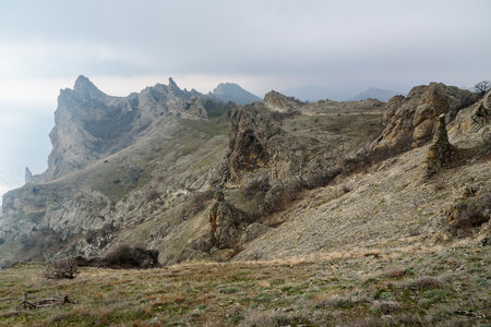 Devil's fireplace rock and bizarre rocks in Dead city. Khoba-Tele Ridge of Karadag Reserve in early spring. Crimeaの写真素材