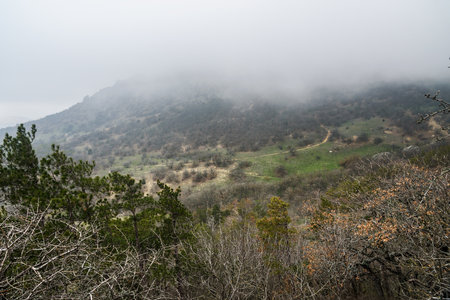 Landscape of Karadag Reserve in early spring. View of mountains in fog and clouds. Crimeaの写真素材