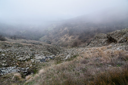 Landscape of Karadag Reserve in early spring. View of mountains in fog and clouds. Crimeaの写真素材