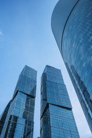 Upward view of City of Capitals skyscrapers in business center of Moscow City on blue background. Moscow. Russiaの写真素材