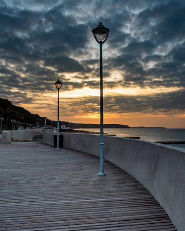 View of the promenade on the beach of the Baltic sea in Svetlogorsk at sunset. Kaliningrad region. Russiaの写真素材