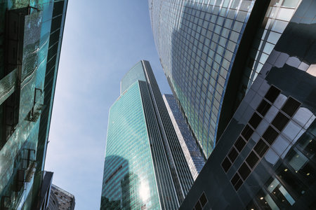 Upward view of modern skyscrapers in business center of Moscow City on blue sky background. Moscow. Russiaの写真素材