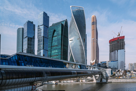 Pedestrian Bridge Bagration on Moscow river with skyscrapers Moscow City on the background in Moscow. Russiaの写真素材