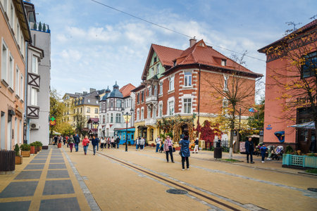 Russia, Zelenogradsk - October 04, 2021: People walking on pedestrian street Kurortny prospect at autumnのeditorial素材