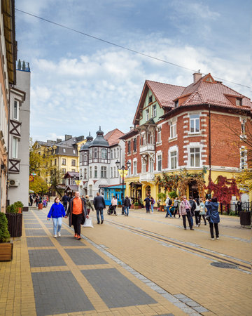 Russia, Zelenogradsk - October 04, 2021: People walking on pedestrian street Kurortny prospect at autumnのeditorial素材