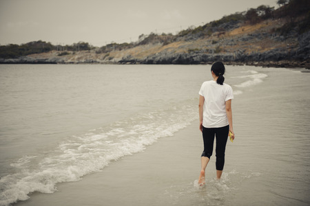 The Girl walking near the beachの写真素材