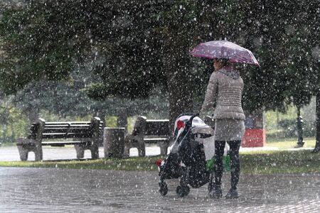 Raincoat under the umbrellaの写真素材