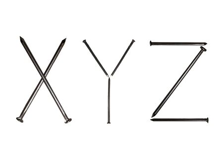 The letters "XYZ" laid out from iron nails on a white backgroundの写真素材