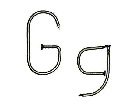 Uppercase and lowercase letters "G g" made of iron nails on whiteの写真素材