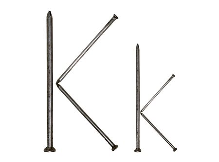 Uppercase and lowercase letters "K k" of iron nailsの写真素材