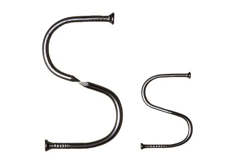 Uppercase and lowercase letters "S s" of iron nails on whiteの写真素材