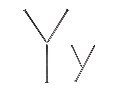 Uppercase and lowercase letters "Y y" made of iron nailsの写真素材