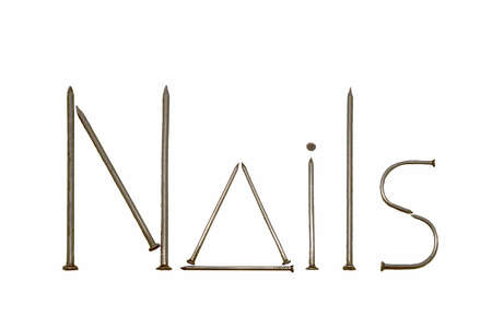 The word "Nails" laid out from iron nails on a white background.の写真素材