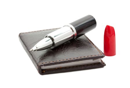 Pen on notebook, isolated on white background.の写真素材