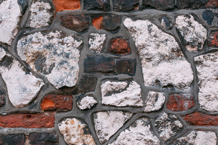 Old brick wall texture background on facade of old houseの写真素材