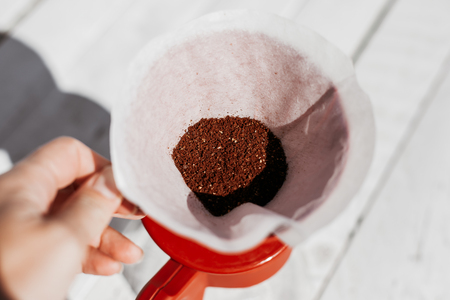 Delicious freshly ground morning coffee powder in the coffee filter. Close upの写真素材