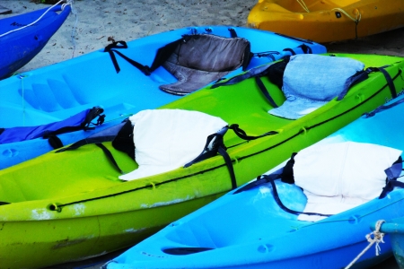 colorful kayaks on the beachの写真素材
