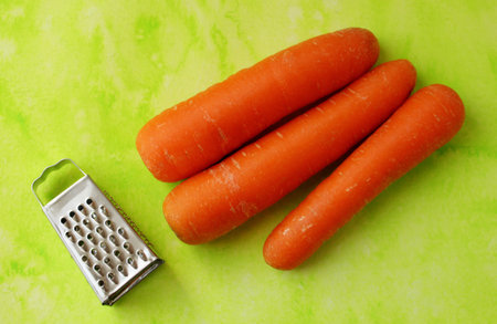 Fresh carrots with a metal grater. Healthy organic vegan food.の写真素材