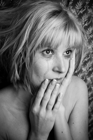 Image of a beautiful blonde in tearsの写真素材