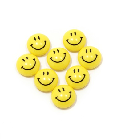 Image of heart made of yellow smileys