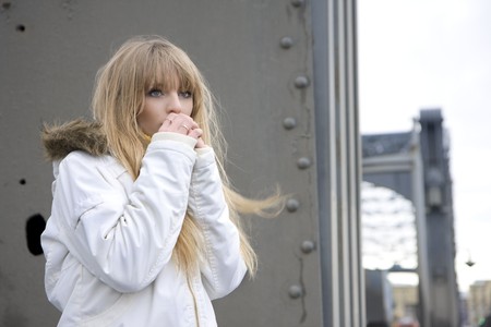 The image of a girl who walks on the background of the cityの写真素材