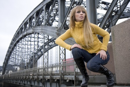 The image of a girl who walks on the background of the cityの写真素材