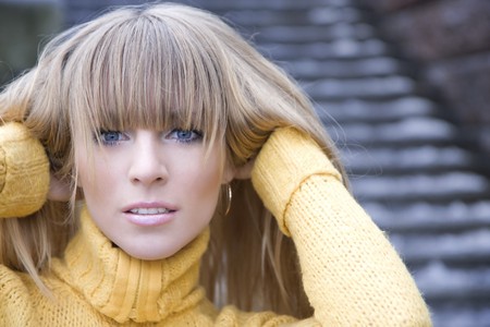 The image of a girl who walks on the background of the cityの写真素材