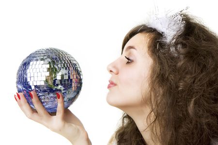 Picture of a beautiful girl, who keeps the ball in the form of the planet Earth in the hands ofの写真素材