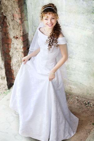Picture of beautiful curly bride against the backdrop of the stone ruinsの写真素材