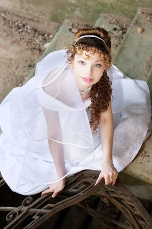 Picture of beautiful curly bride against the backdrop of the stone ruinsの写真素材