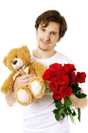 Picture of a man who gives bear and a bouquet of rosesの写真素材