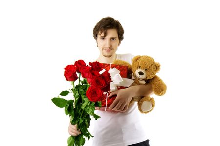 Picture of a man who gives bear and a bouquet of rosesの写真素材