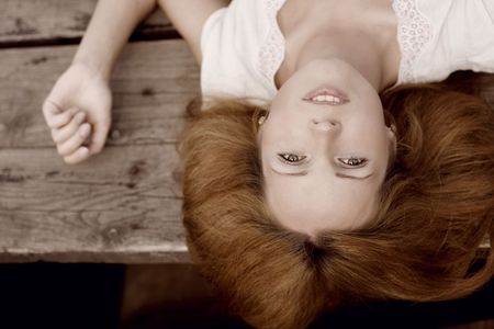 The image of a beautiful girl on the pierの写真素材