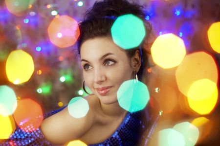 Images of a beautiful girl in the bright night lightsの写真素材