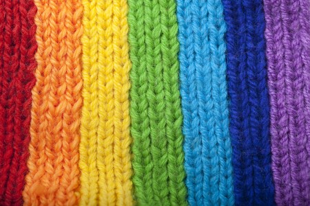 The image of a bright rainbow knitted scarfの写真素材
