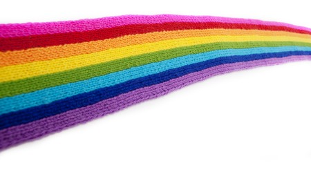 The image of a bright rainbow knitted scarfの写真素材