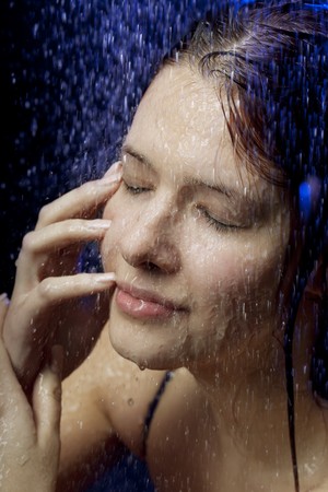 Images of a beautiful girl in the water and sprayの写真素材