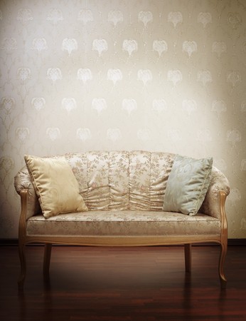 Images of the luxury gold glamorous sofa in the background of vintage wallpaperの写真素材